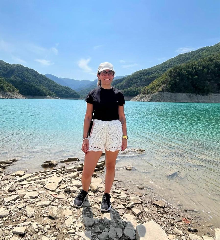 a person standing on a rocky beach