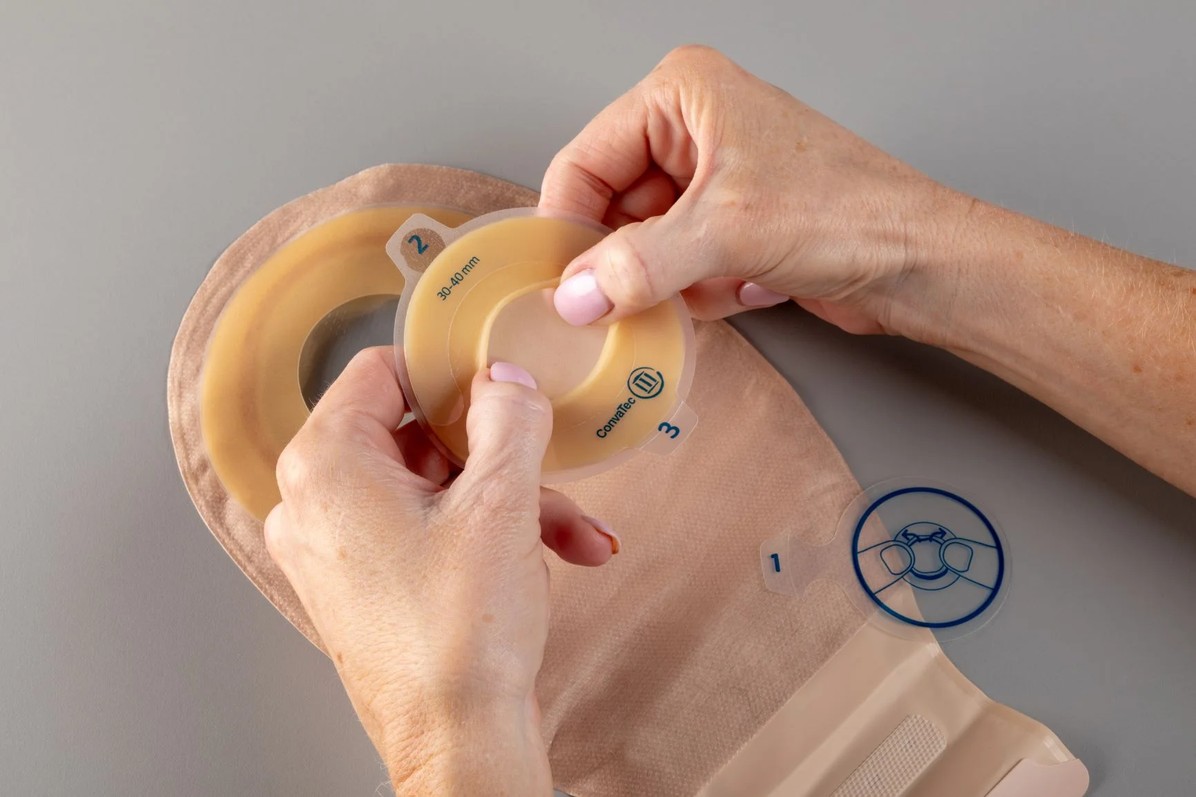 a person holding a yellow tape
